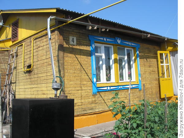 Дом общитый досками