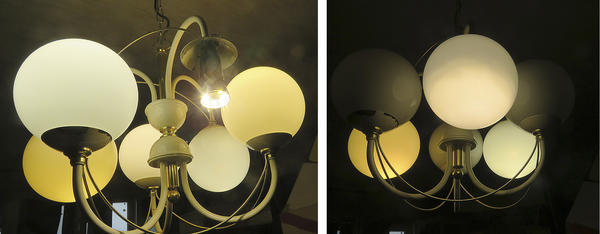 Для тестирования светодиодная лампа "Старт" после ремонта вкручена в люстру с закрытым плафоном. Фото автора